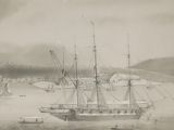 a black and white photo of a ship in the water
