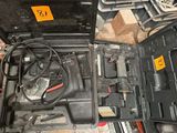 a black tool box with tools in it on the floor