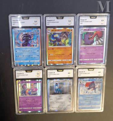 a lot of pokemon cards on display on a table