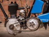 a close up of a motorcycle with a chain attached to it