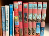 many books that are on a book shelf together