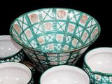 four bowls and a bowl sitting on a table