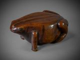 an image of a wooden frog sitting on top of a table