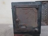 an old metal mailbox with a bird design on it