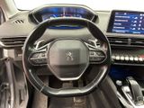the interior of a car with a steering wheel, dashboard, and electronic controls