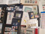 a collection of stamps and stamps on a table
