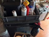 a black box filled with assorted items sitting on the floor