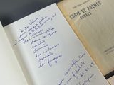 several open books with handwritten notes on them sitting on top of a table