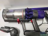 a vacuum that is sitting on a table next to other items