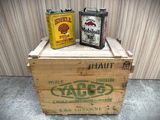 two cans of beer sitting on top of a wooden crate
