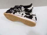 vans old skooler black and white cow print low top sneakers