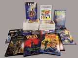 a lot of comic books that are on the table