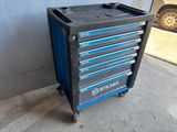 a black and blue tool cabinet sitting on top of a cement floor