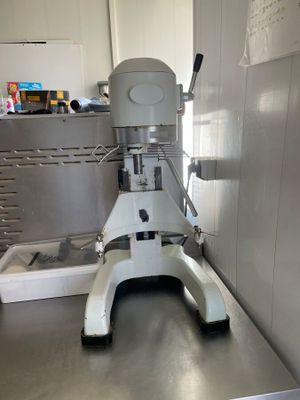 a machine that is sitting on a table in a kitchen