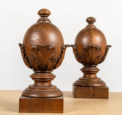 two wooden vases sitting on top of a table next to each other
