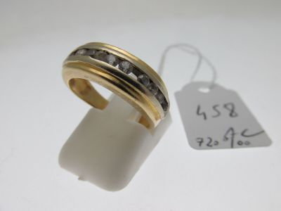 an image of a gold ring with black diamonds and a price tag