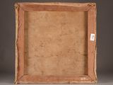 an old wooden picture frame with a label on it