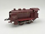 a toy train on a white surface with a white background