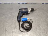 a drill with a cord attached to it sitting on a table