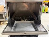 an image of a stainless steel oven sitting on top of a table