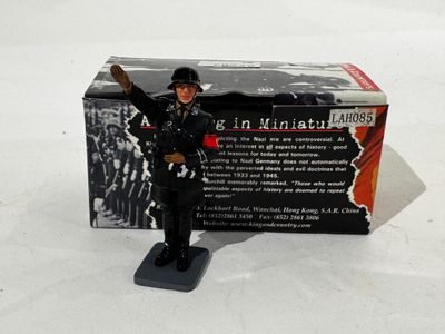figurine of a man in a military uniform holding a gun