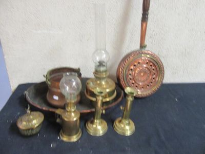 a lot of antique brass items on the table