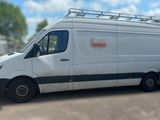 a white van that is parked in a parking lot