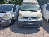 two vans parked next to each other in a parking lot