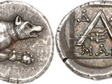 a close up of a silver coin with a dog on it