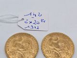two gold coins with a price tag and a price tag