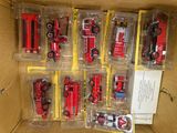 a box full of different types of toy fire trucks
