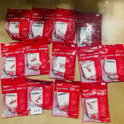 a lot of red bags of toothbrushes sitting on a table