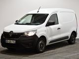 la camionnette blanche est garée dans une pièce au sol en damier