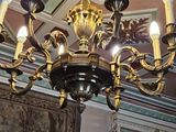 a chandelier with five lights hanging from it ' s ceiling