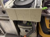a machine that is sitting on the floor next to other machines