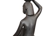 an image of a statue of a woman with a pot on her head