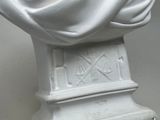 a statue of a man with a white cloth draped over his head