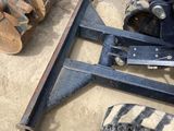 a picture of a fork and a tractor in the sand