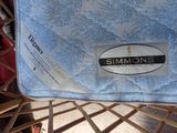 a blue mattress that is sitting on a chair