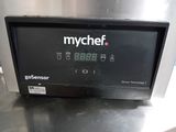 an image of a kitchen counter with a digital clock