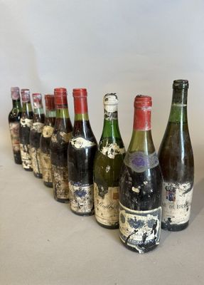 several bottles of wine lined up in a row on a table