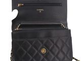 a close up of a black purse on a white background