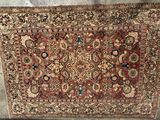 an antique persian rug on display in a museum