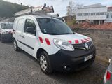 a white van with red and white stripes parked in a parking lot