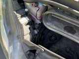 the engine compartment of a car with the hood open
