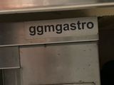 a sign on the side of a building that says gomgastro