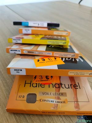 three boxes of cigarettes sitting on top of a table next to each other