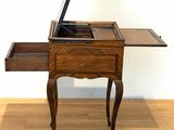 a small table with a laptop on top of it