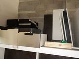 a shelf that has a bunch of boxes on it