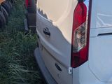 a white van that is parked in the grass